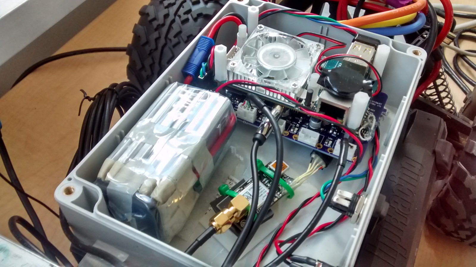 Board assembled in enclosure